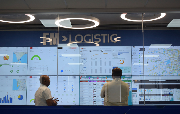 Logistics control tower displaying real-time supply chain dashboards in a central operations control room at FM Logistic. Mobile version of the picture.
