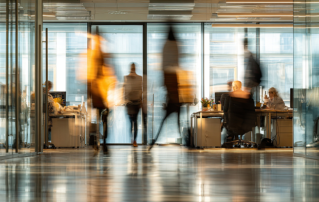 Employees working in a modern office, illustrating collaboration and strategic planning around full-service logistics for mid-sized businesses. Mobile version of the picture.